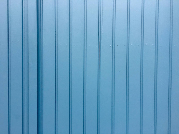 Old wooden door of a garage with blue color  - 写真・画像