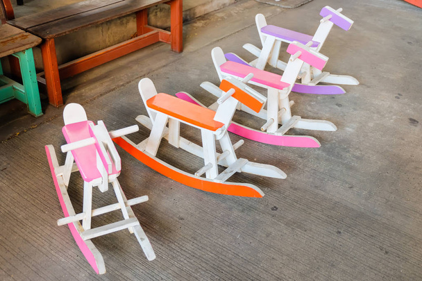 Colorful vintage rocking horse wooden chair for children could enjoy, Thailand. - Photo, Image