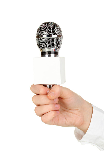 Female hand with microphone isolated on white - Foto, afbeelding
