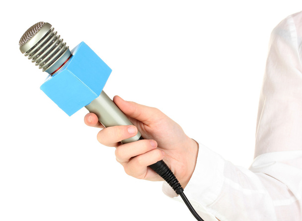 Female hand with microphone isolated on white - Fotó, kép