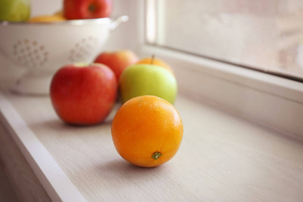 Fresh fruits on windowsill - Фото, изображение
