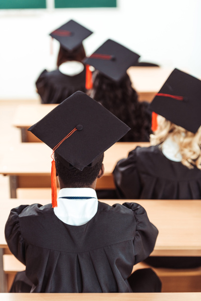 students in graduation hats - Φωτογραφία, εικόνα