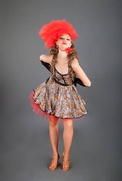 Charming Woman in Bright Dress Poses in Photo Studio - Фото, зображення
