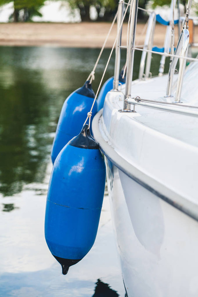 Blue float, fenders on board - Φωτογραφία, εικόνα