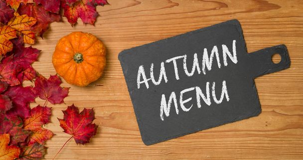 Autumn foliage with a blackboard - Autumn Menu - Foto, imagen