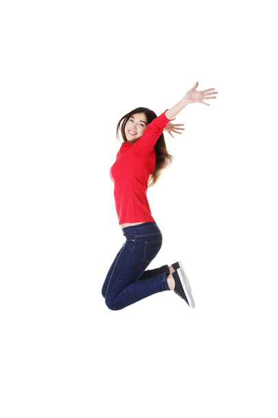 Happy caucasian woman jumping in the air - Φωτογραφία, εικόνα