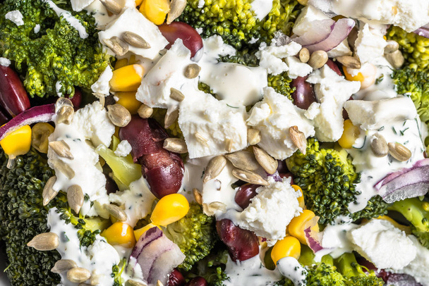 Broccoli salad with vegetables and feta cheese. - Photo, Image