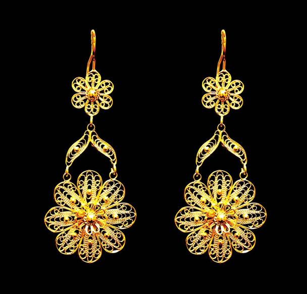 beautiful Oriental gold Turkish jewelry womens earrings black background - Photo, Image