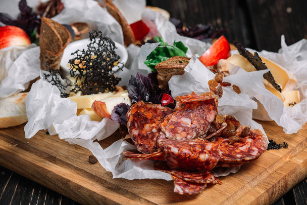 Cheese and meat appetizer selection. Different kinds of salami and cheese - Fotoğraf, Görsel