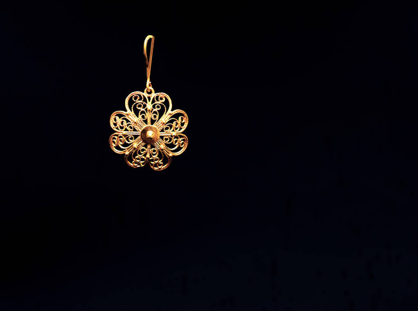 beautiful vintage Oriental gold Turkish jewelry womens earrings black background - Photo, Image