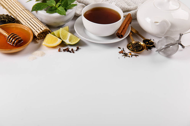 Beautiful arrangement of tea spices on table - Фото, зображення
