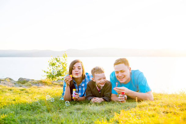 Happy family outside - Valokuva, kuva
