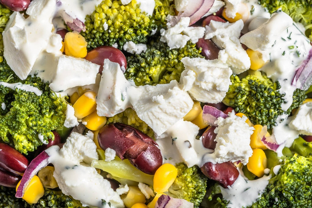 Broccoli salad with vegetables and feta cheese. - Photo, Image