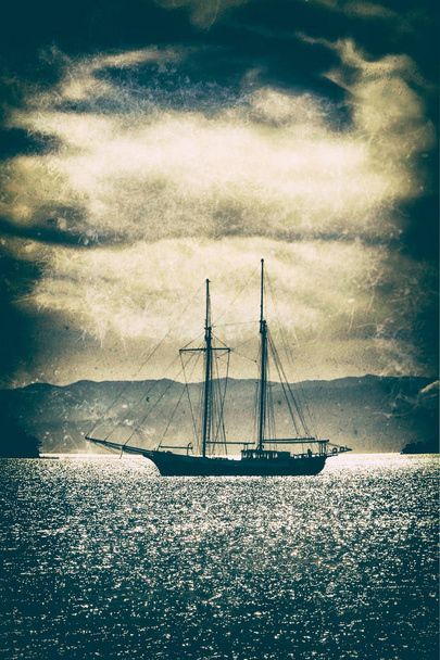 Old wooden ship in the sea under a dramatic sky.Fine art image canvas texture added. - Photo, Image