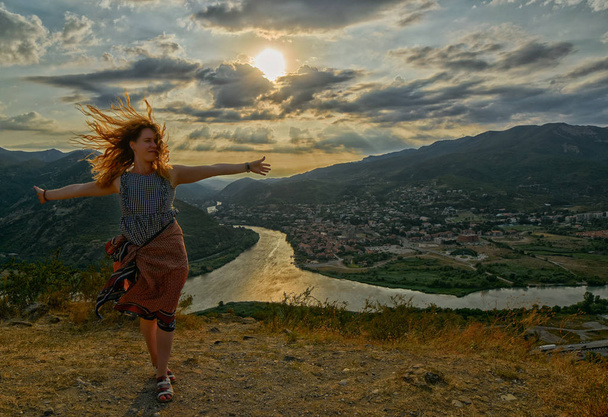Happy young woman near Jvari Monastery of Georgia - Fotografie, Obrázek