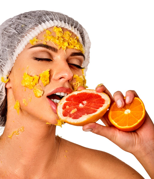 Facial mask from fruits for woman. Girl in medical hat. - Foto, Imagen