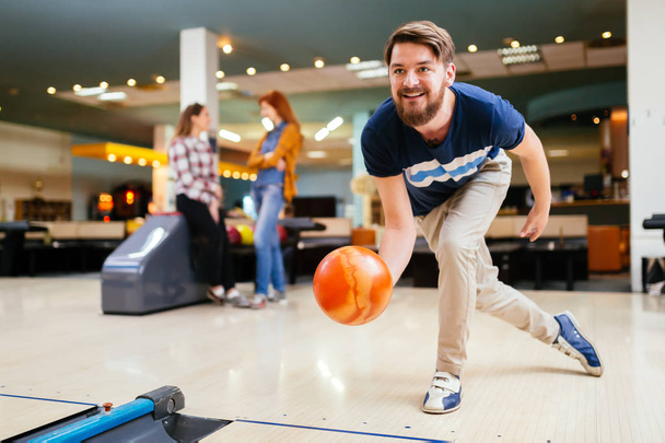 Friends having fun while bowling - Fotografie, Obrázek