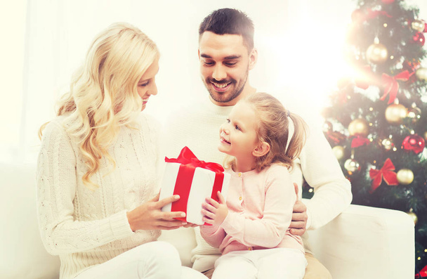 happy family at home with christmas tree - Foto, imagen