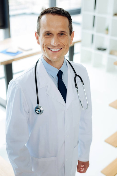 Delighted happy doctor wearing a stethoscope - Foto, Imagem