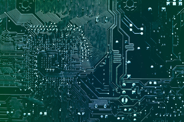Dark background of the silhouette of the computer motherboard for the design of the company's IT site. Circuit board. Electronic computer hardware technology. Motherboard digital chip. - Photo, Image