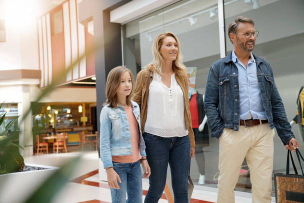 Family on shopping day walking in mall - Foto, Imagem