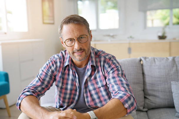 Portrait of mature man with eyeglasses looking at camera - Photo, image