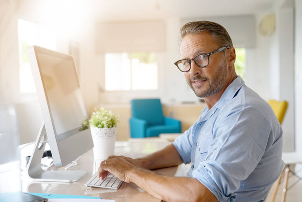 Mature man working from home  - Foto, Imagem