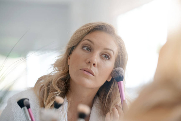 woman applying makeup - Photo, Image