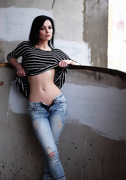 Beautiful young woman in a striped T-shirt - Fotoğraf, Görsel