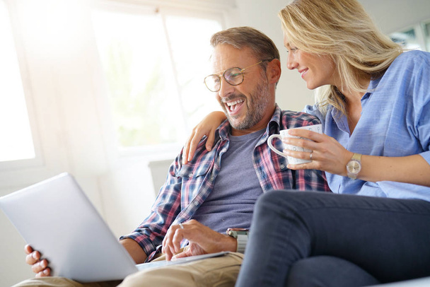 Mature couple connected on internet  - Photo, Image