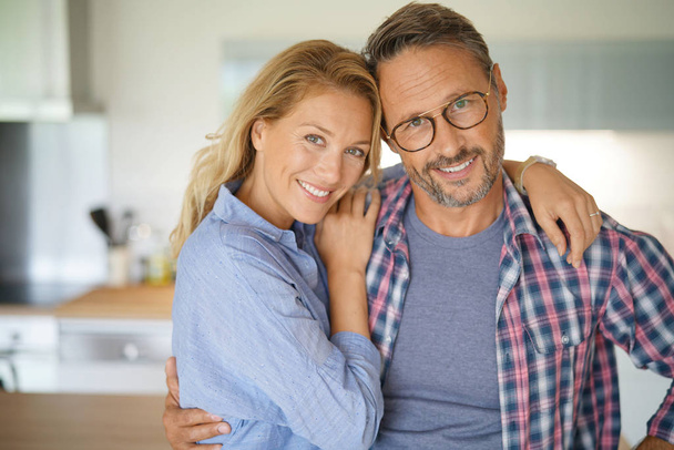 couple standing in home kitchen - Photo, Image