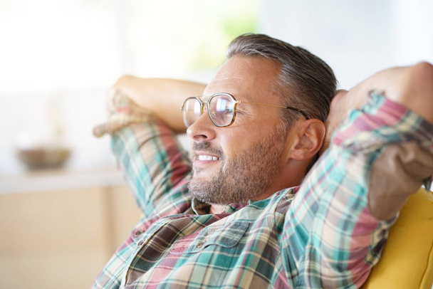 man with eyeglasses relaxing  - Zdjęcie, obraz