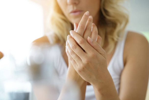 woman's hands applying moisturizing hand-cream - Foto, Imagen