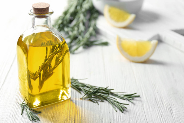 Bottle with rosemary oil and herb  - Foto, Imagem