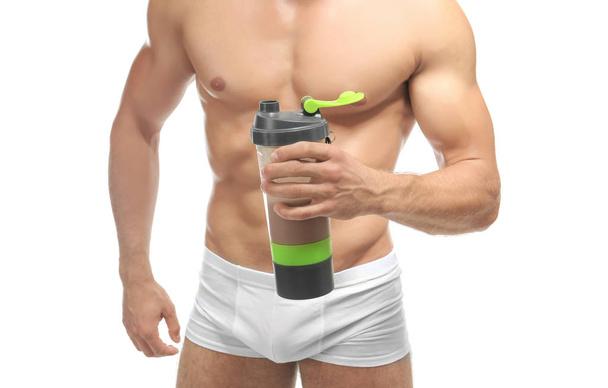 Muscular man with protein shake - 写真・画像