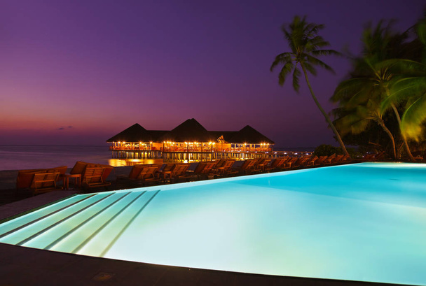 Pool and cafe on tropical Maldives island - Photo, Image