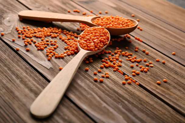 Spoons with healthy lentils  - Фото, изображение
