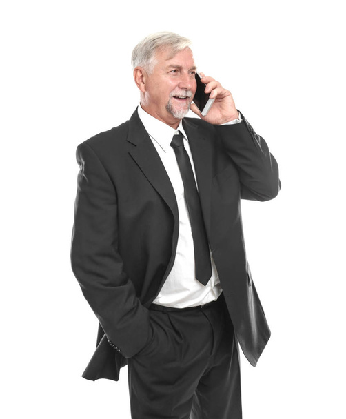 Elderly man talking by mobile phone on white background - Fotografie, Obrázek