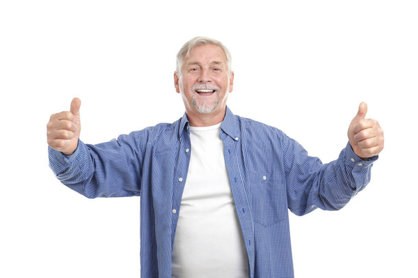 Happy elderly man showing thumbs up on white background - Фото, изображение