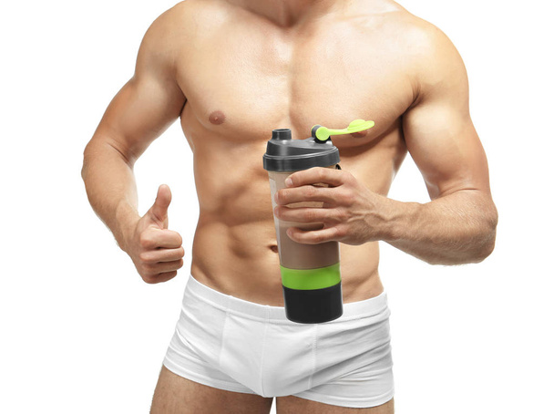 Muscular man with protein shake - Фото, зображення