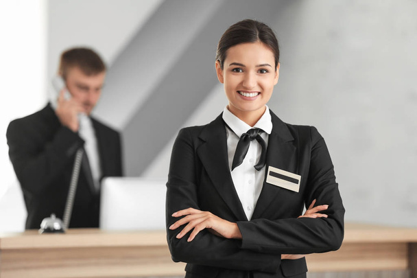 Female hotel receptionist at workplace - Photo, image