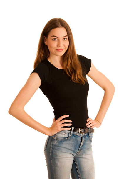 attractive young woman in jeans and black t shirt isolated over  - Foto, afbeelding
