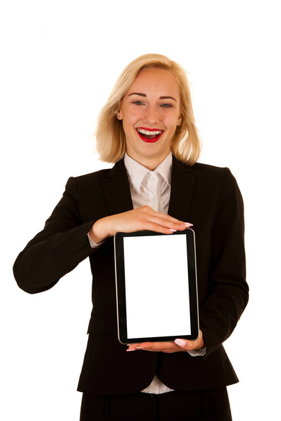 Attractive young business woman shows tablet with blank display  - Фото, изображение