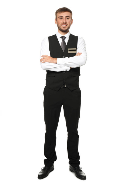 Male hotel receptionist in uniform on white background - Fotó, kép
