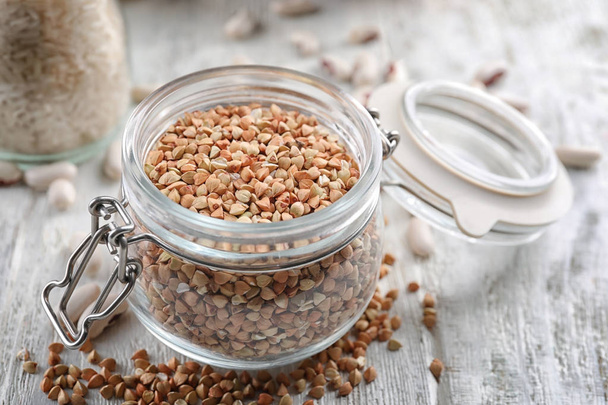 Jar with buckwheat grains  - Photo, Image
