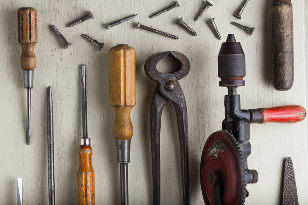 Construction tools set on wooden light background. Assortment instruments for repairman, carpenter, builder. Copy space for text. Top view - Foto, Imagem