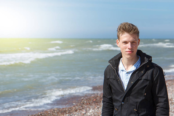young man near sea - Фото, изображение