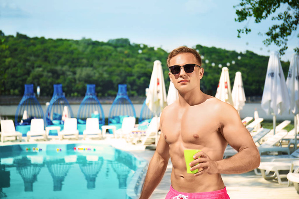 Attractive man near swimming pool - Fotoğraf, Görsel