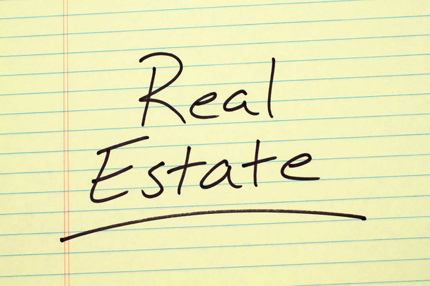 Real Estate On A Yellow Legal Pad - Photo, Image