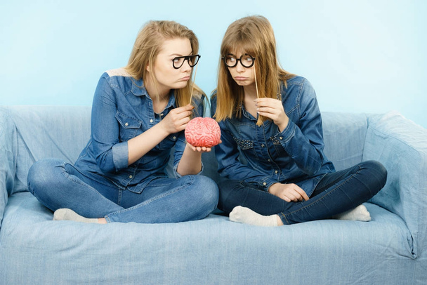 Two serious women friends thinking - Foto, imagen